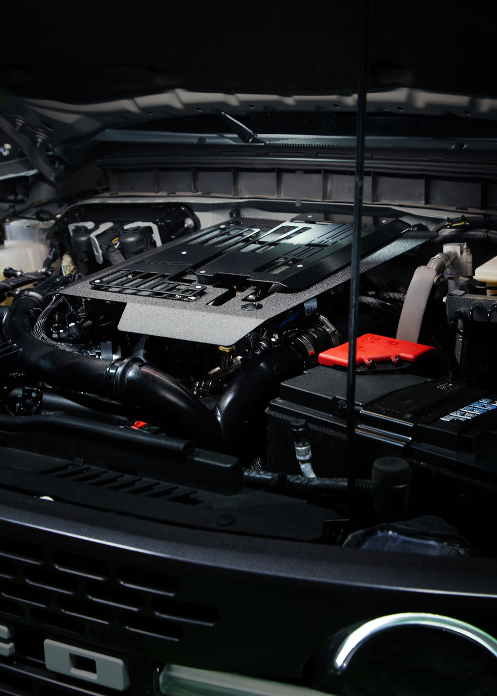 Retrove quick release aluminum engine cover installed on a 2.7L Ford Bronco.